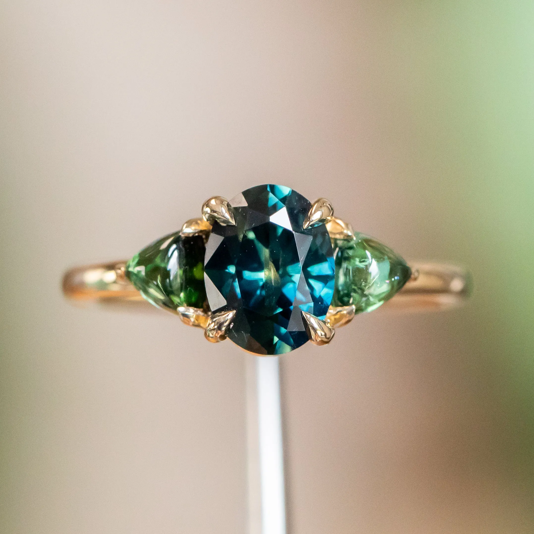 1.63ct Oval African Teal Blue Sapphire and Tourmaline Cabochon Trillion Three Stone Ring in 14K Yellow Gold