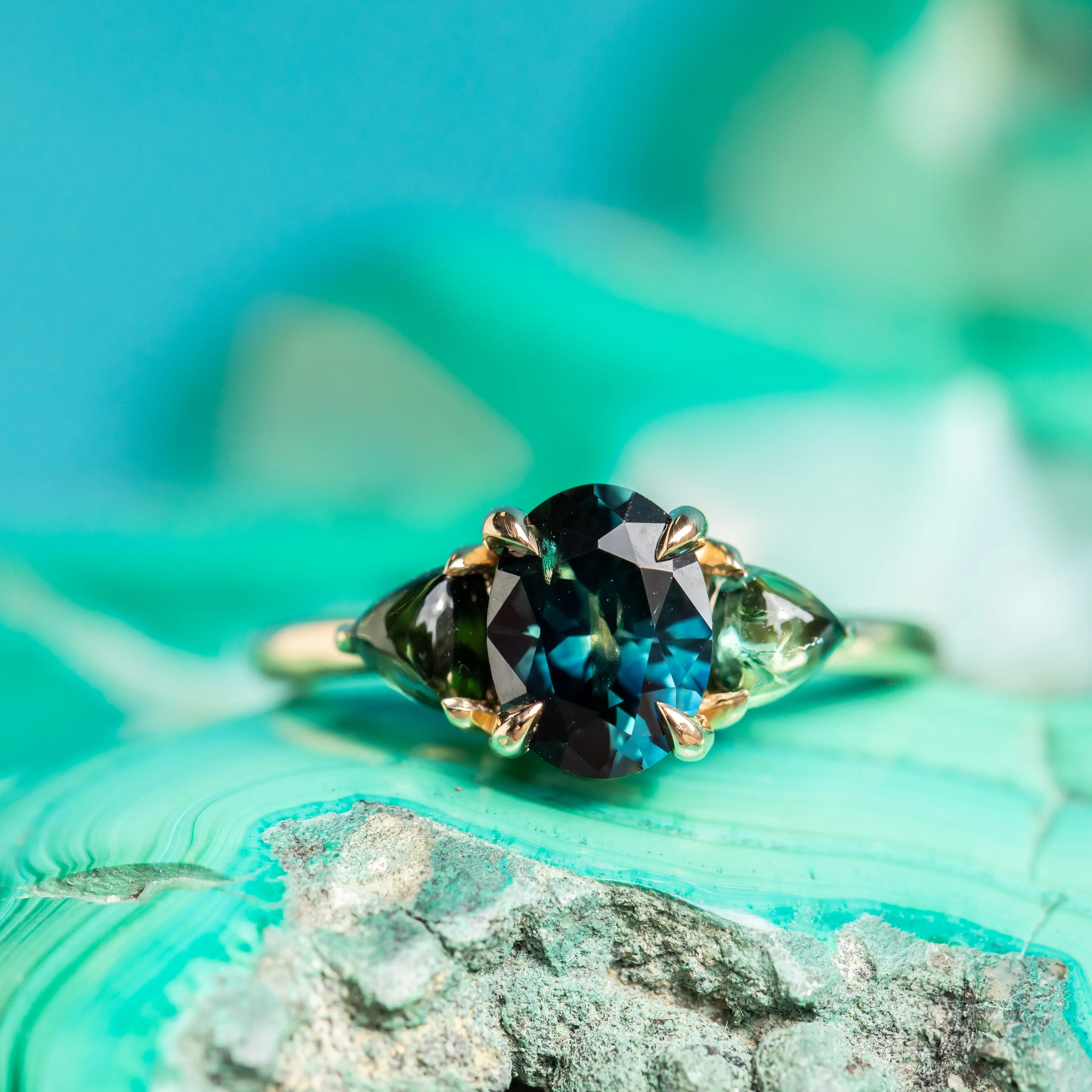 1.63ct Oval African Teal Blue Sapphire and Tourmaline Cabochon Trillion Three Stone Ring in 14K Yellow Gold